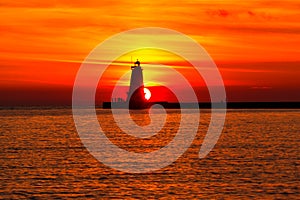 Ludington Pier Lighthouse at Sunset. Michigan USA photo
