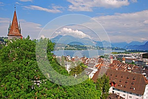 Luegislandturm watch tower & birds eye view of city Lucerne, Switzerland with Swiss typical buildings, pointy roofs & Lake Lucerne