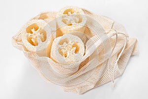 Luffa Loofah. Vegetable sponge extracted from the Luffa plant in cotton mesh bag. Eco friendly loofahs sponges, zero waste.