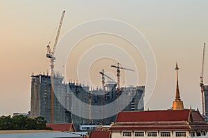 Luffing jib tower crane at condominium construction site over st