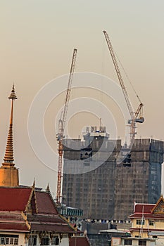 Luffing jib tower crane at condominium construction site over st