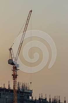 Luffing jib tower crane at condominium construction site over st