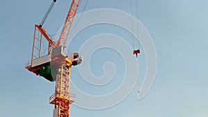 Luffing jib tower crane soars into blue sky