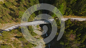 Luftaufnahme Schurpfen Wasserfall. Aerial view of crooked waterfall Schurpfen and bridge in gorge with forested mountain