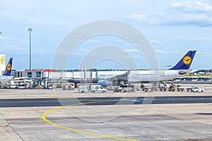 Lufthansa aircraft parking at the apron in Frankfurt, Germany. There is Lufthansas primary traffic hub and the majority of