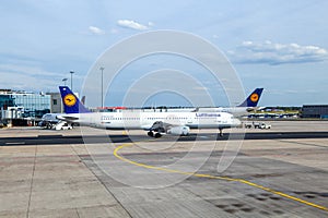 Lufthansa aircraft parking at the apron in Frankfurt, Germany. There is Lufthansas primary traffic hub and the majority of