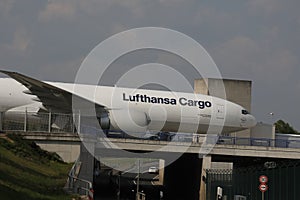 Lufthansa Cargo plane over bridge doing taxi in Frankfurt Airport, FRA, close-up view