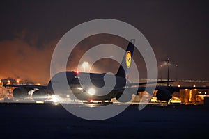Lufthansa A380 plane doing taxi in Munich Airport, MUC, night scene