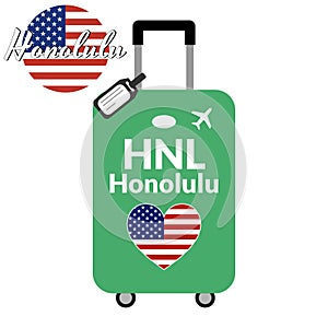 Luggage with airport station code IATA or location identifier and destination city name Honolulu, HNL. Travel to the photo