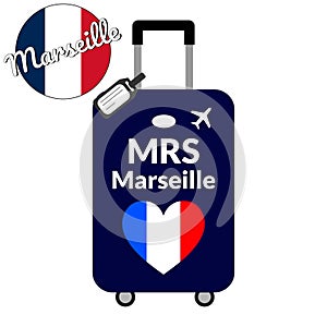 Luggage with airport station code IATA or location identifier and destination city name Marseille, MRS. Travel to France