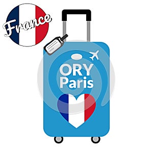 Luggage with airport station code IATA or location identifier and destination city name Paris, ORY. Travel to France photo