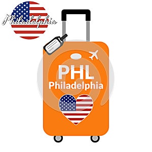 Luggage with airport station code IATA or location identifier and destination city name Philadelphia, PHL. Travel to the
