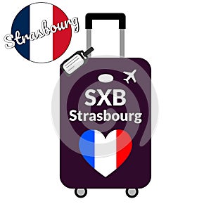 Luggage with airport station code IATA or location identifier and destination city name Strasbourg, SXB. Travel to