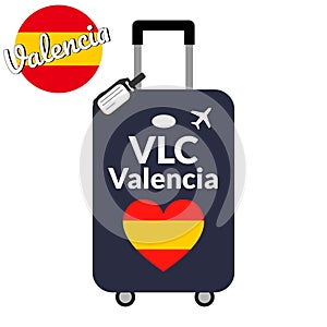 Luggage with airport station code IATA or location identifier and destination city name Valencia, VLC. Travel to Spain photo