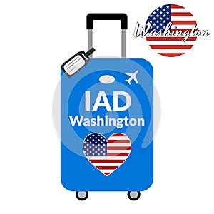 Luggage with airport station code IATA or location identifier and destination city name Washington, IAD. Travel to the