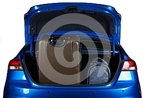 Luggage in blue modern sedan car trunk