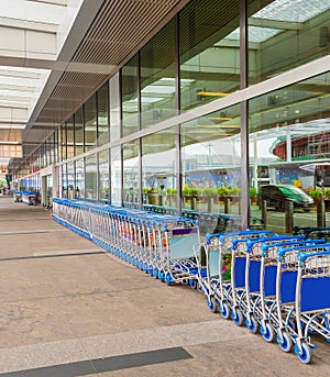 luggage carts by airport entrance