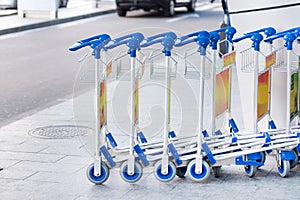 Luggage carts at the entrance of international airport terminal