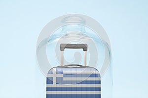 Luggage in isolation under glass cover covid-19 Greece tourism abstract