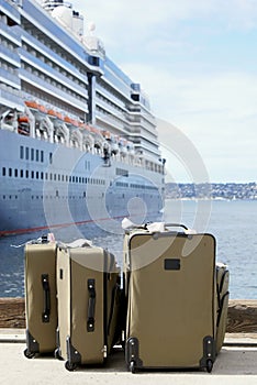 Luggage Next To Cruise Ship on Dock