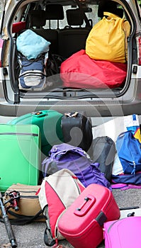 Luggage ready to be loaded on a car for the holidays