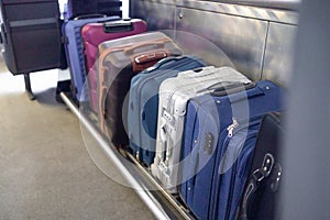 Luggage on shelf railway train. Holiday vacation, tourism, travel, modern train interior, railway transportation concept