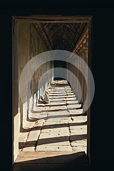 A lugubrious corridor made of rocks in the ruins of the Bayon temple in Ankgor Thom, Cambodia - World Heritage by UNESCO in 1992 photo