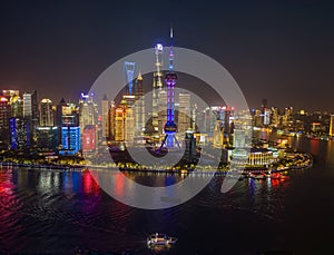 The drone aerial view of Lujiazui, Pudong, Shanghai at night time.