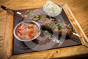 Lula kebab with tomato salsa