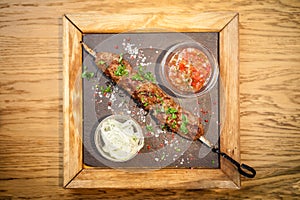 Lula kebab with tomato salsa