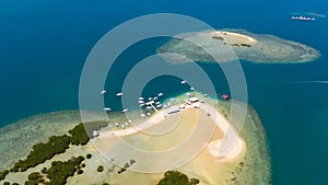 Luli island, Puerto Princesa, Palawan.Lots of boats on the beach, tourist route. Island hopping Tour at Honda Bay, Palawan