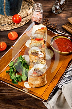 Lulia kebab sliced in pita bread with sauce photo