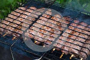 Lulya kebab from meat are prepared in the grill. Shish kebab in the grill.