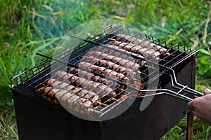 Lulya kebab from meat are prepared in the grill. Shish kebab in the grill.