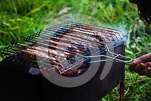 Lulya kebab from meat are prepared in the grill. Shish kebab in the grill.