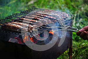 Lulya kebab from meat are prepared in the grill. Shish kebab in the grill.