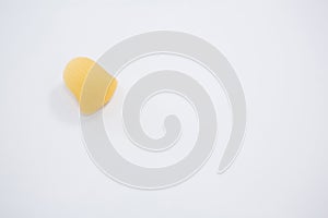 Lumache rigate pasta on white background