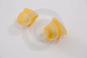 Lumache rigate pasta on white background
