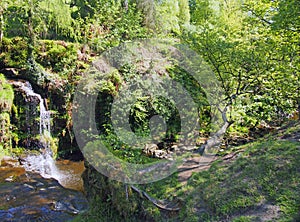 lumb hole falls a waterfall in woodland at crimsworth dean near pecket well in calderdale west yorkshire