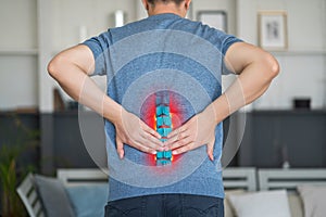 Lumbar intervertebral spine hernia, man with back pain at home, spinal disc disease