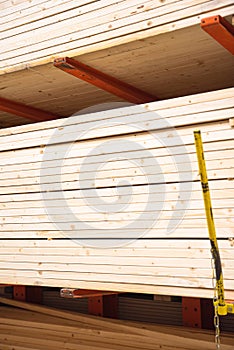 Lumber shelves with chain link preventing warehouse rack collapse full of pine lumber straighter grain at home improvement