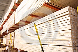 Lumber shelves with chain link preventing warehouse rack collapse full of pine lumber straighter grain at home improvement