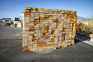 Lumber stacked in a bundle at a construction site