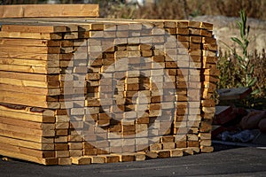 Lumber stacked in a bundle at a construction site