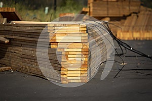 Lumber stacked at a housing construction site