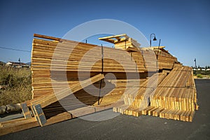 Lumber stacked at a housing construction site