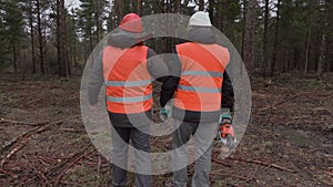 Lumberjacks talking in forest