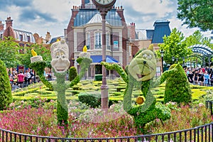 Lumiere and Cogsworth character topairy displayed at Epcot