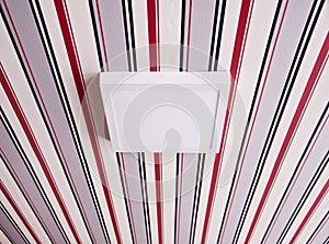 Luminaire lamp on the striped ceiling