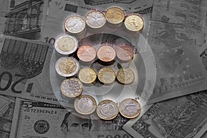 Luminous euro sign from euro coins